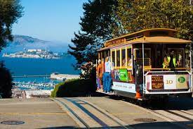cable car with alcatraz behind