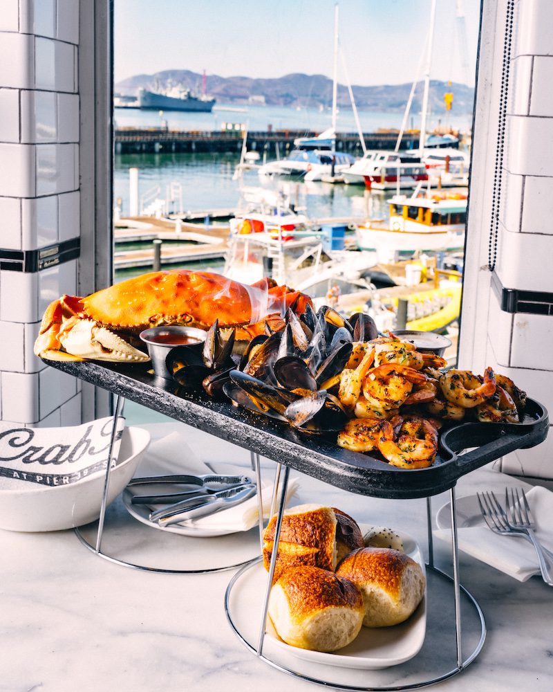 Different kinds of seafood presented on a tray at Crab House at Pier 39