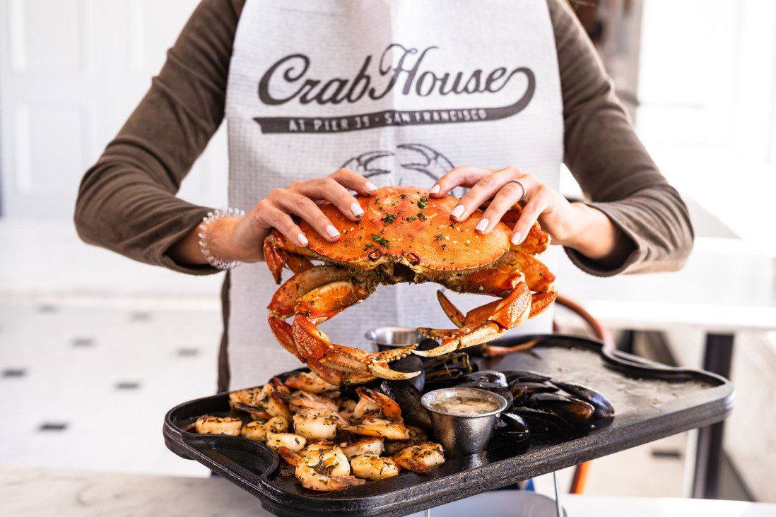 Woman holding Dungeness crab