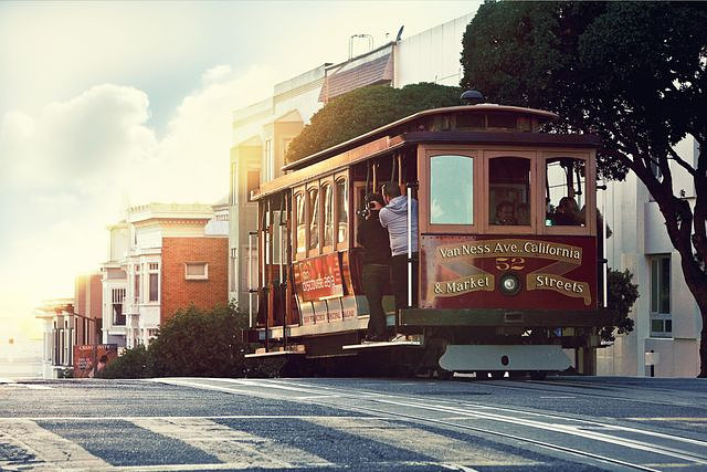 Historic cable car date idea, climbing steep hills in San Francisco