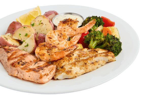 Salmon, potatoes, and vegetables on a plate
