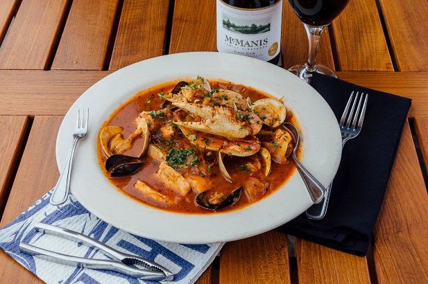 Cioppino served with wine